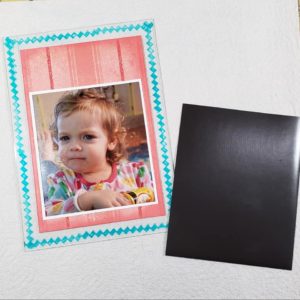 What grandparent wouldn't love this fridge magnet to show off a favorite photo?