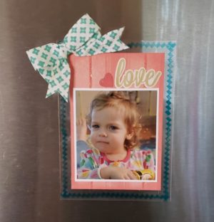 What grandparent wouldn't love this fridge magnet to show off a favorite photo?